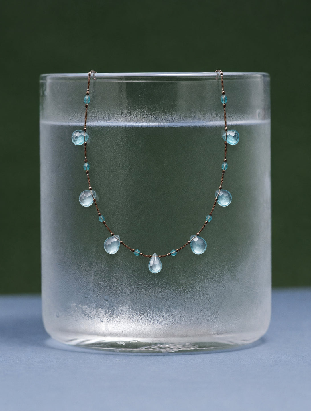 LUMERUNE Dewdrop Blue Topaz Necklace — blue topaz drops on a delicate cord