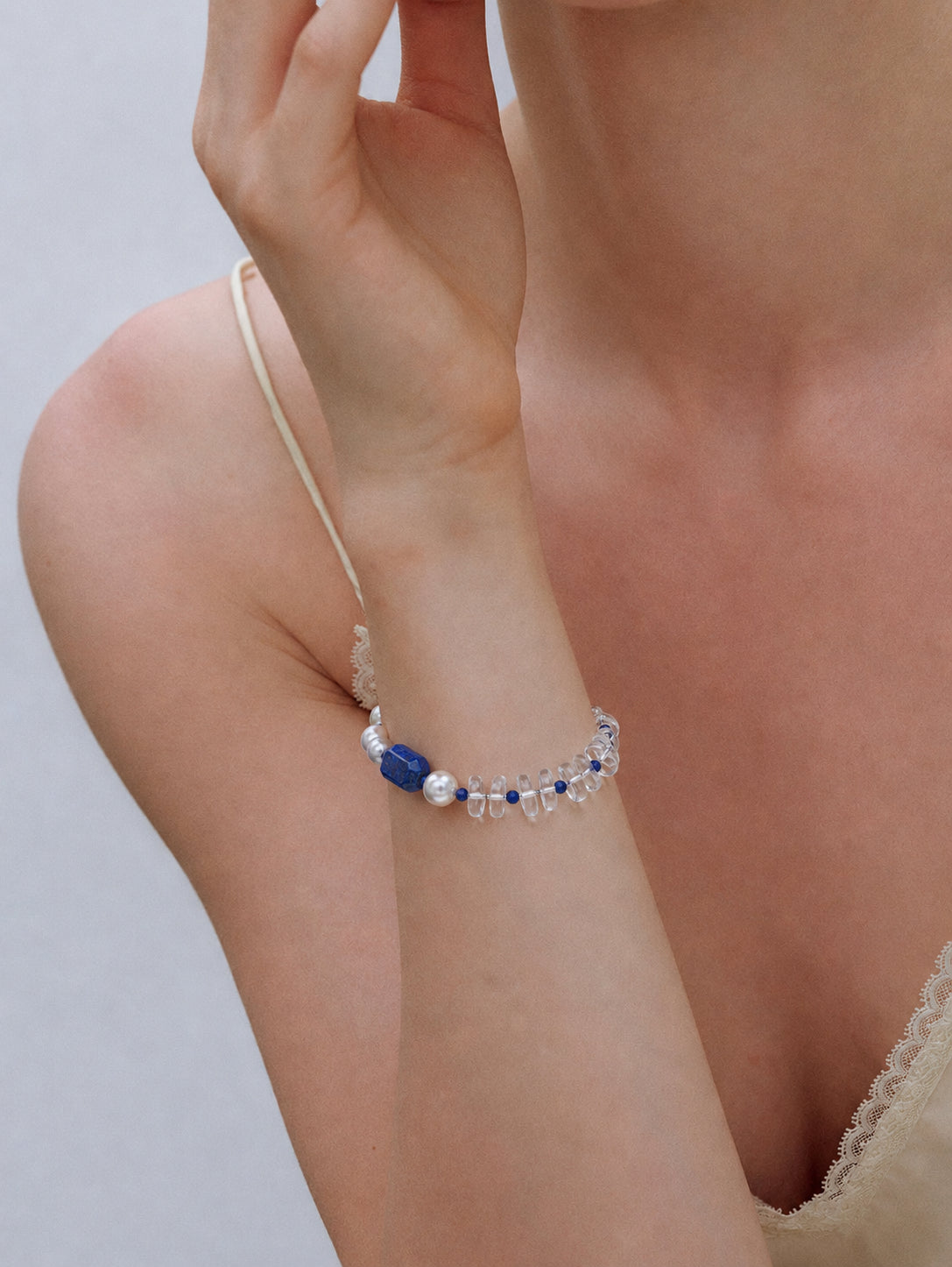 LUMERUNE Orbit Lapis Lazuli and Clear Quartz Bracelet — deep blue gemstones, clear quartz and baroque pearls
