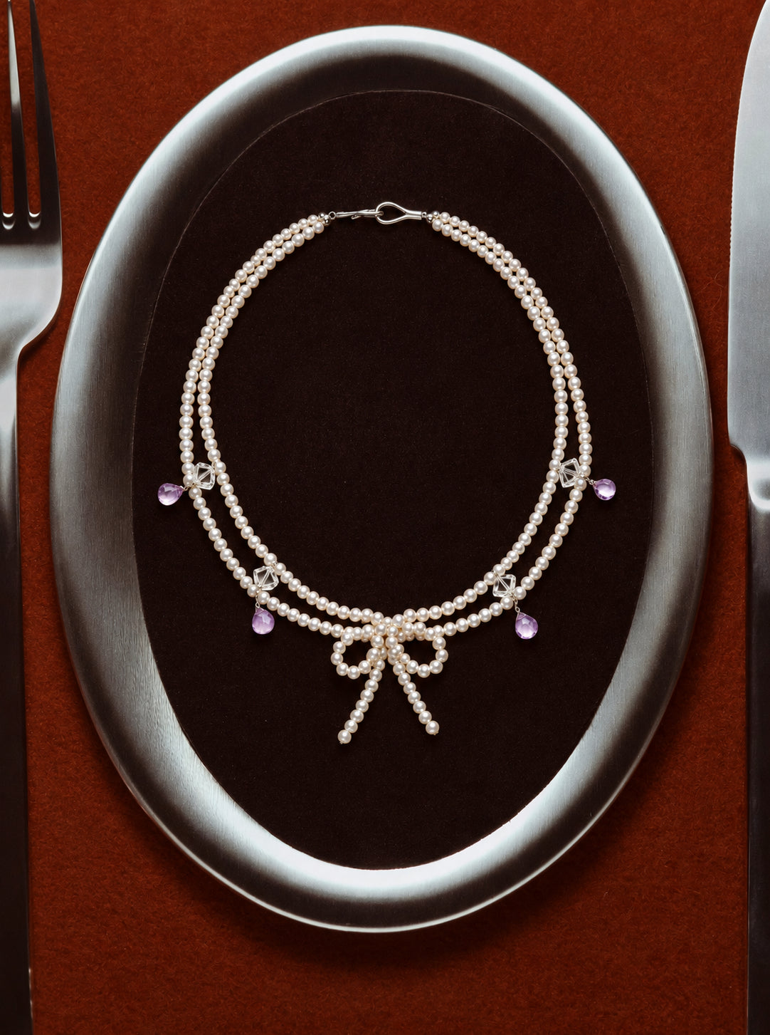 LUMERUNE Muse Pearl Bow Necklace With Amethyst — seed pearls, clear crystal, amethyst drops and a pearl bow
