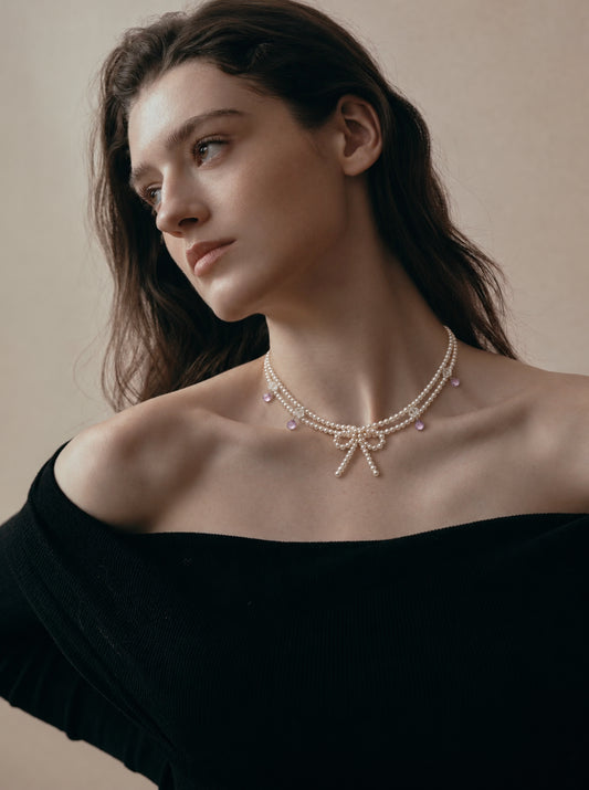 LUMERUNE Muse Pearl Bow Necklace With Amethyst — seed pearls, clear crystal, amethyst drops and a pearl bow