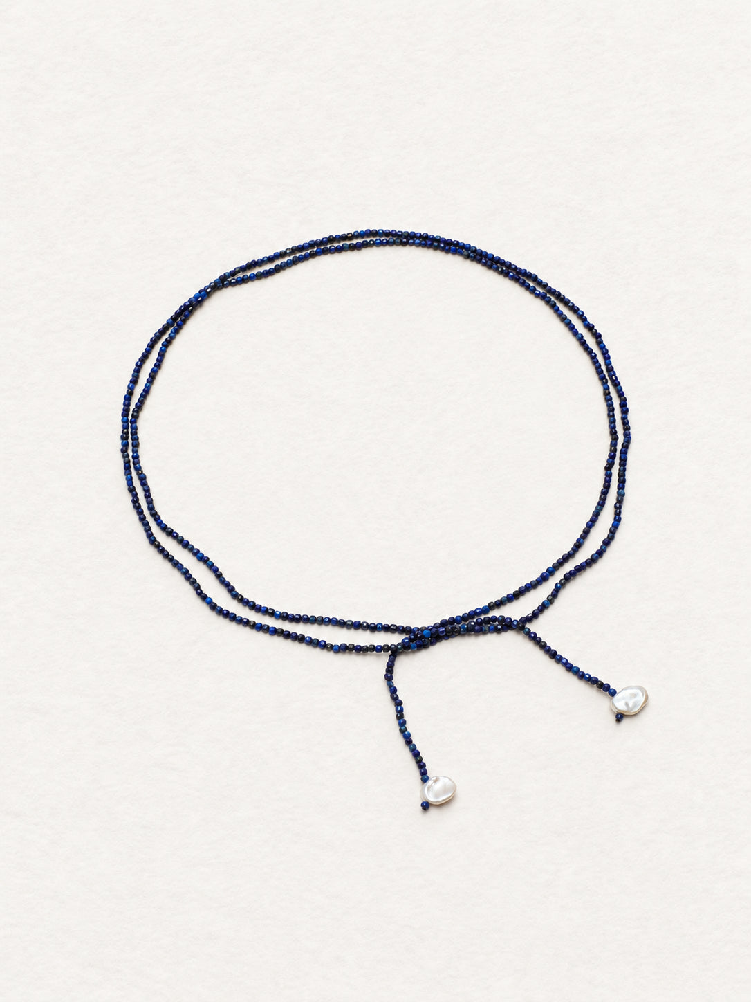 LUMERUNE Nightfall Ribbon Lapis Lazuli Necklace With Pearl — tiny lapis lazuli beads and petal accents