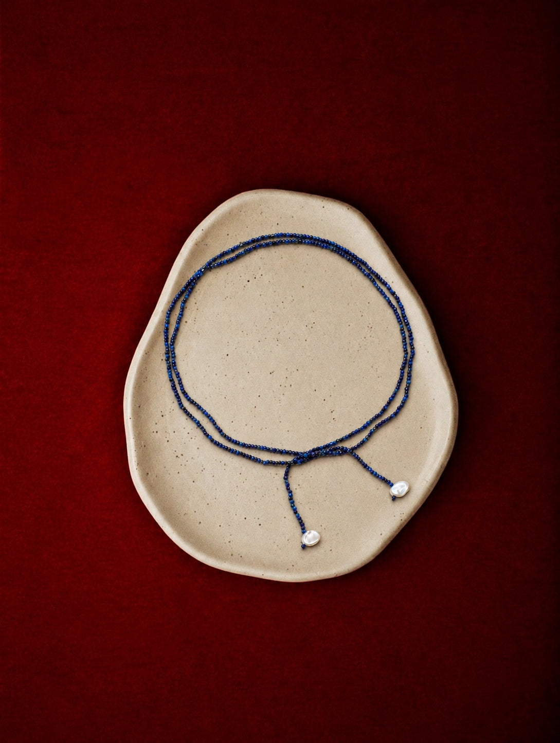 LUMERUNE Nightfall Ribbon Lapis Lazuli Necklace With Pearl — tiny lapis lazuli beads and petal accents