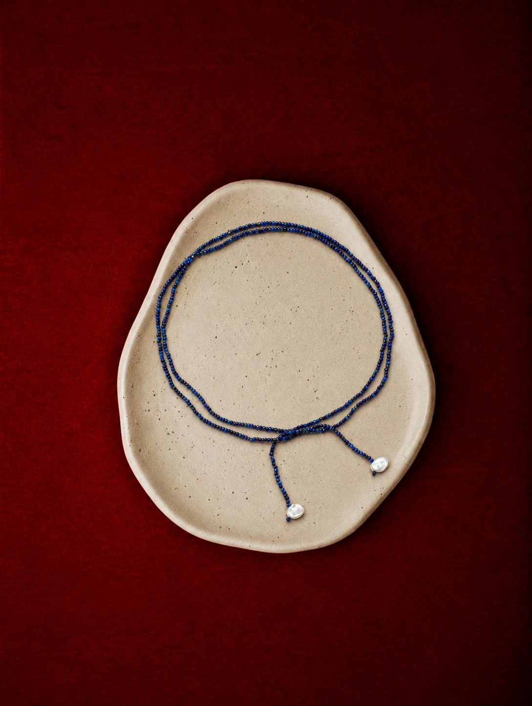 LUMERUNE Nightfall Ribbon Lapis Lazuli Necklace With Pearl — tiny lapis lazuli beads and petal accents