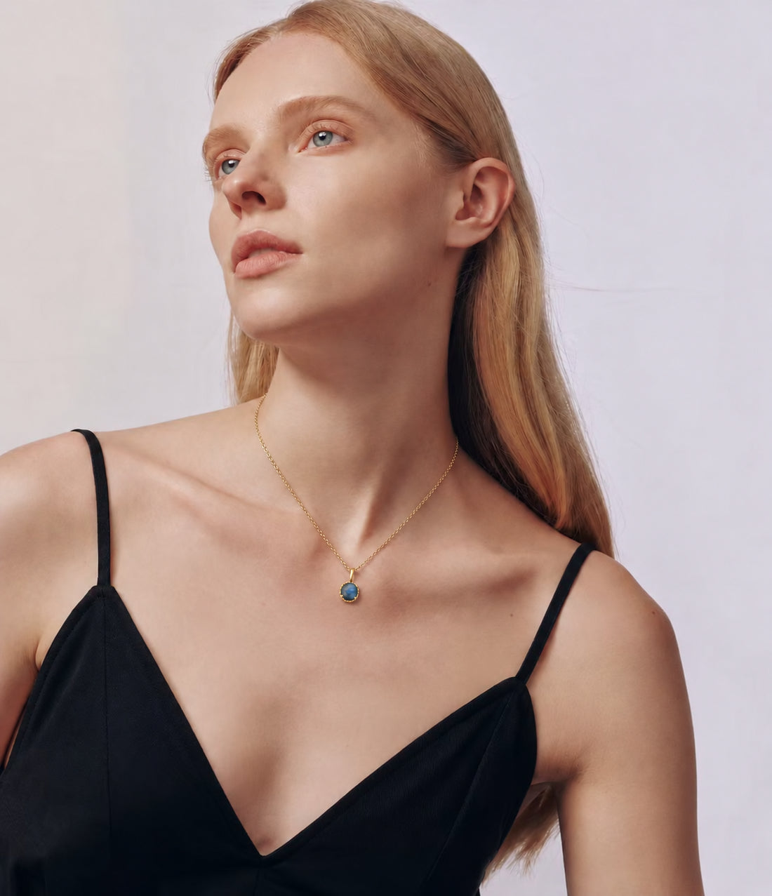 LUMERUNE Moonveil reversible lapis lazuli and labradorite pendant in a gold toned setting