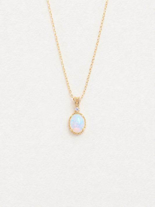 LUMERUNE Lunar Opal Starlight Pendant — oval opal in a gold toned setting with a white zircon