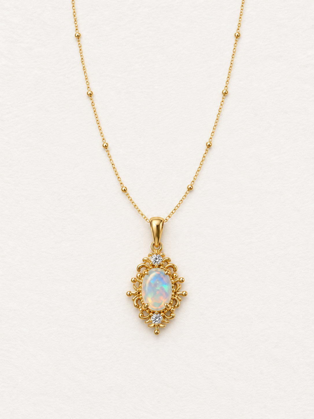 LUMERUNE Lunar Opal Iris Pendant — opal framed by gold toned iris petals