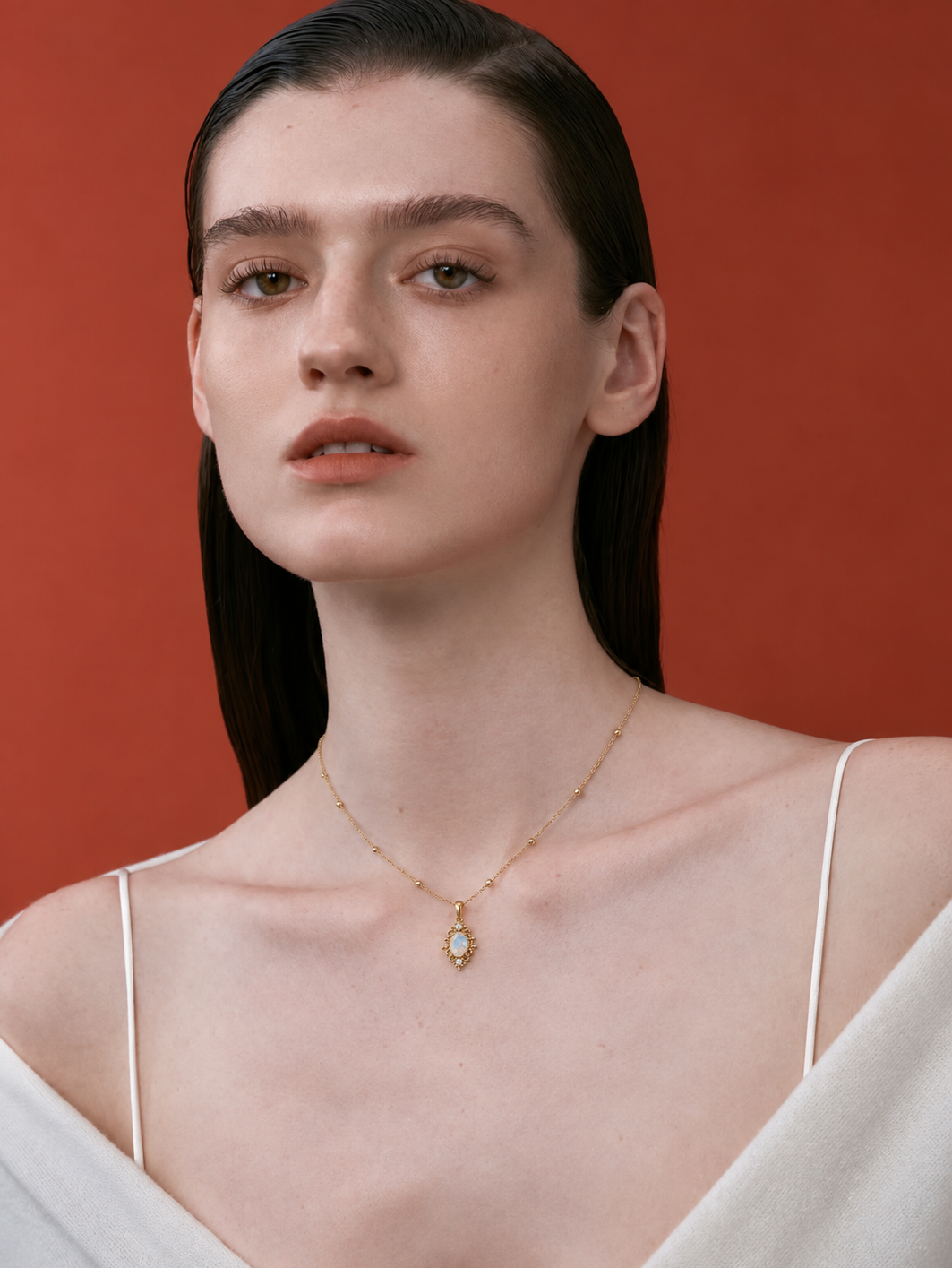 LUMERUNE Lunar Opal Iris Pendant — opal framed by gold toned iris petals
