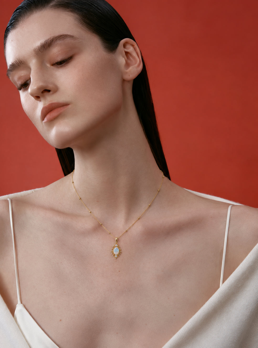 LUMERUNE Lunar Opal Iris Pendant — opal framed by gold toned iris petals
