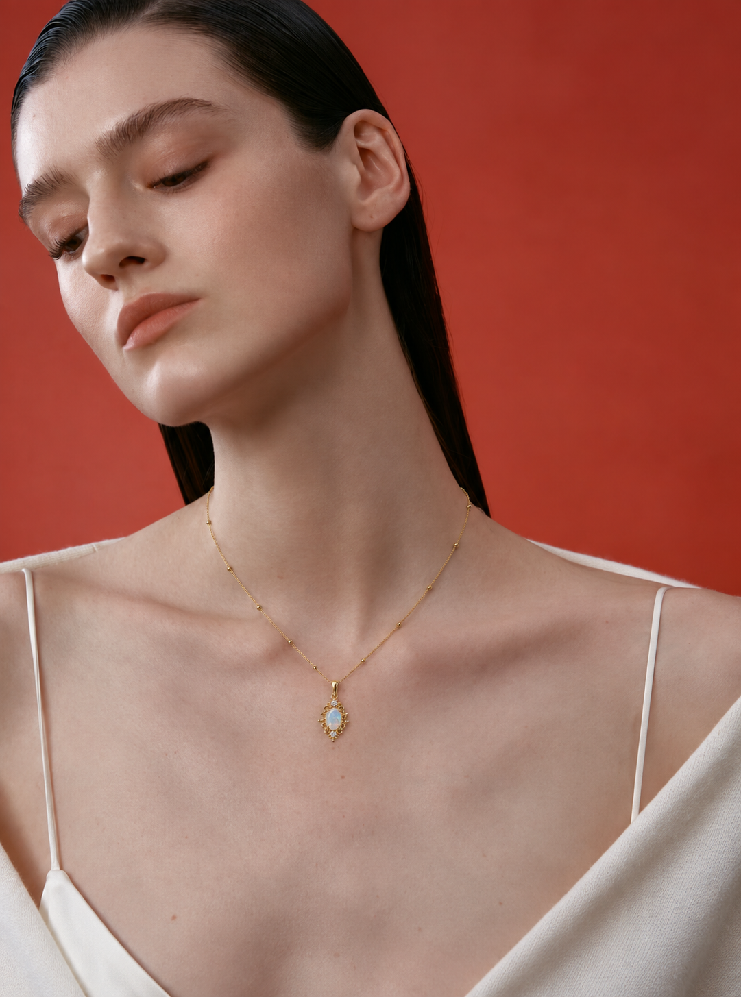LUMERUNE Lunar Opal Iris Pendant — opal framed by gold toned iris petals