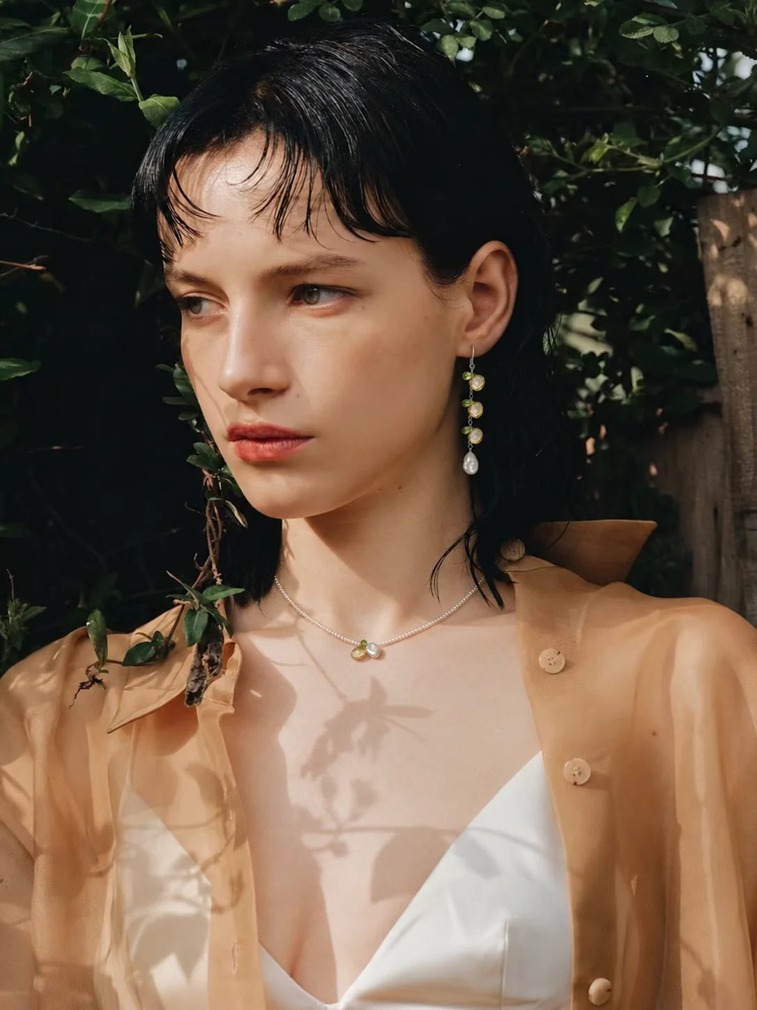 LUMERUNE Golden Meadow citrine, peridot and pearl necklace and earrings worn outdoors